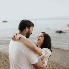 An embrace by the ocean. We encourage natural interactions to create authentic couple shoot inspiration, resulting in photos that feel as real and happy as the moment itself.