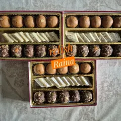 An assortment of Sattu Laddoos, Kaju Katli, and Ragi Laddoos in festive boxes. I prepared these for a client celebrating Rakhi early before her brother went abroad.
