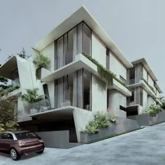 The facade of the Moira Homes features large overhangs with inbuilt planters. This design choice allows diverse greenery to become an integral part of the built scape, extending the landscape vertically along the building's exterior.