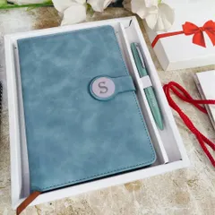Here is the same diary and pen set in a cool Arctic Blue color. The high-quality faux leather has a lovely texture, and the personalized initial on the magnetic lock adds a special touch.