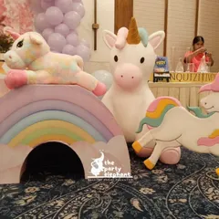 Themed props are key to creating an immersive world. For this unicorn party, I included adorable unicorn and rainbow cutouts and plush toys that doubled as decor and a play area for the little guests.