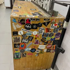 The side of the DJ booth, covered in stickers from artists and labels around the world. It's a physical representation of our global connections.