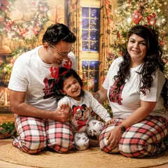 Our themed mini sessions are all about creating joyful memories. This family's laughter during our Christmas postcard shoot shows how much fun we have bringing festive ideas to life.