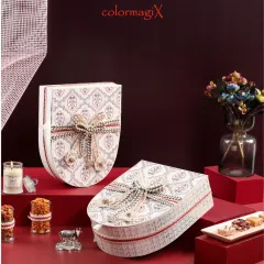 The shield-shaped gift boxes, shown both open and closed, highlighting their distinctive design and beautiful craftsmanship.