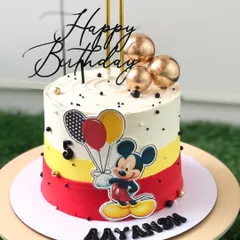 Celebrating a fifth birthday with the one and only Mickey Mouse. This cake features a clean, modern design with Mickey's signature colors and a festive balloon theme.