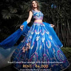 Make a bold statement with this royal cobalt blue lehenga with pearl embellishments. A beautiful contrast to traditional Haldi colors.