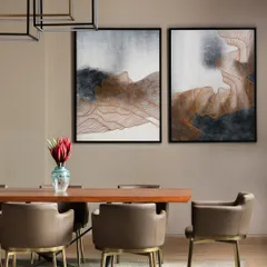 "Art washes away from the soul the dust of everyday life." This dining room at the KKB Residence embodies that idea, with large abstract paintings setting a sophisticated and contemplative mood. The leather chairs and wood table add warmth and texture.