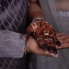 The moment he puts a ring on it. The rich stain of her engagement mehendi makes this shot even more special.