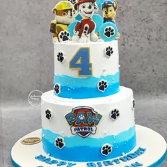 A fantastic two-tiered Paw Patrol cake for a 4th birthday. This cake features the main characters, the Paw Patrol logo, and cute paw prints all around, ready for a ruff-ruff rescue party.