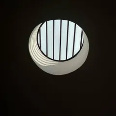 A simple yet effective circular skylight. I use skylights to bring daylight into the deepest parts of a building, reducing the need for artificial lighting and creating interesting plays of shadow.