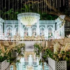 The difference is in the details. This close-up shows the intricate glass-like stage and floral chandelier from one of my premium wedding decor setups, reflecting my commitment to creating a truly breathtaking ambiance.