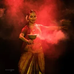 Embodying the goddess Durga, surrounded by red smoke to signify her power and intensity. Theatrical elements like this help create a powerful, immersive experience for the audience.
