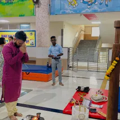 I am seen here offering prayers during the Dussehra puja at our center. It is important for us to honor our traditions and instill these values in our students.