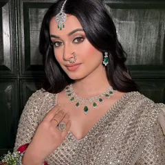 Capturing the complete bridal vision. The makeup, jewelry, and outfit come together in perfect harmony for a look that is both regal and radiant.