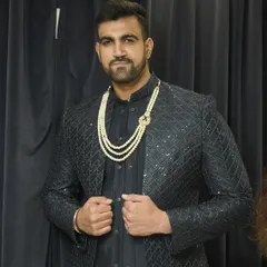 A confident pose in our black textured Indo-western outfit. The pearl mala adds a touch of traditional elegance to this contemporary look.