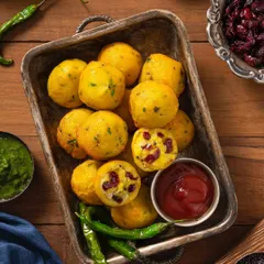 Savory appe (paniyaram) with a cranberry twist, shot for US Cranberries India. The overhead angle and rustic props highlight the dish's ingredients and texture.