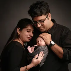Those first few days are pure magic. We create a calm, quiet space in our studio for newborn family portraits, focusing on the tender connection between you and your new baby.