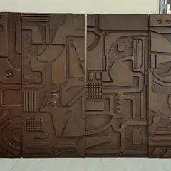 This set of four wooden art panels was a custom project for a home in Jaipur. Each panel features intricate, carved abstract patterns, creating a cohesive and sophisticated gallery wall with a rustic, modern feel.