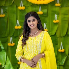 A lovely portrait of Inchara Joshi. Her simple, elegant makeup and soft curls create a look that is both youthful and timeless.