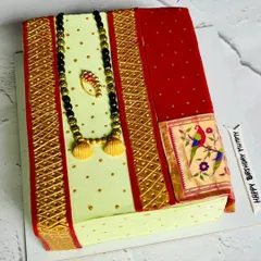 I love bringing unique ideas to life, like this cake designed to look like a traditional Paithani saree. The intricate details, from the golden border to the edible mangalsutra and nath, are all handcrafted to honor our beautiful culture.