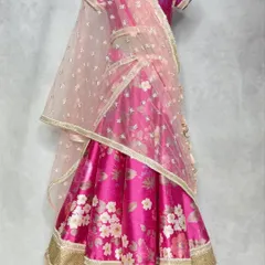 A full view of the in-house printed floral lehenga, showing how the soft net dupatta and layered skirt create a dreamy, romantic effect.
