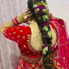 A side view of the floral braid, highlighting how the flowers are woven through the hair.