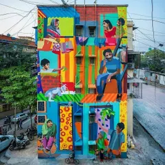 This vibrant, multi-story mural titled "Me/We" captures the spirit of community in Mumbai. It's a colorful depiction of daily life, showing different families and individuals coexisting in a single building, a true reflection of the city's soul.