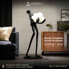 Inspired by Nordic creativity, this human sculpture lamp is a study in form and light. The slender, artistic figure holding a cluster of glowing orbs serves as a standalone sculpture, bringing a modern, gallery-like feel to your interior.