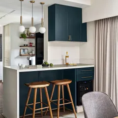 We turned a narrow passage into a stylish and functional bar counter and breakfast nook. This area features a wine cooler, extra storage, and comfortable seating, making it the perfect spot for a morning coffee or an evening drink.