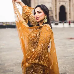 A bold and beautiful portrait in front of the Gateway of India. The way her dupatta catches the wind adds a lovely sense of movement and grace to the image.
