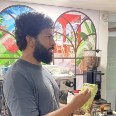International Indian barista Adwaith Menon explaining the properties of oat milk during a hands-on workshop at our academy.