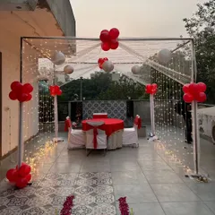 I can transform any terrace into a private dining escape. This classic romantic dinner setup features a structured cabana draped with sheer fabric and twinkling fairy lights, creating the perfect intimate setting for an anniversary or special date night.