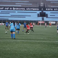 Our players battling for possession during a competitive match against Red United Football Academy at the KSFA Stadium.