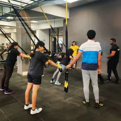 Our athletes engage in a TRX suspension training session at the gym. This full-body workout builds the core strength and endurance necessary for peak performance.