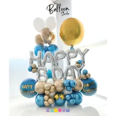 A classic "Happy Bday" balloon bouquet in blue and gold. These arrangements are perfect for photos and add a festive touch to any space.