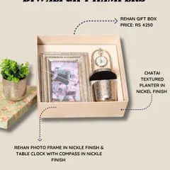 The Rehan gift box is another lovely option, featuring a photo frame and a table clock with a compass, both in a modern nickel finish.