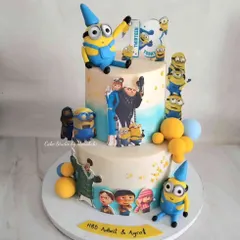 A fun-filled two-tier Minions cake I made for twins. The design is covered with the mischievous yellow characters from the Despicable Me movies, perfect for a shared celebration.