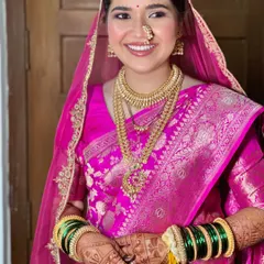 A modern Maharashtrian bride in all her glory. I loved creating this look, balancing the vibrant pink Banarasi silk with radiant skin and traditional gold jewelry for a timeless yet fresh feel.