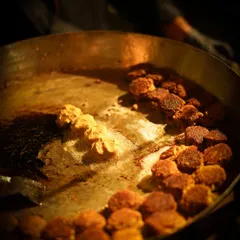 Our chefs pan-frying delicate Galouti kebabs to perfection. These melt-in-the-mouth kebabs are a specialty and a constant request from our clients for their events.