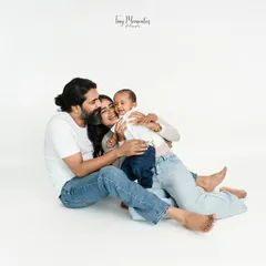 Wrapped in love. These quiet, candid family portraits on a clean white backdrop put all the focus on your family's unique connection.