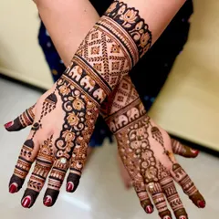 Mehendi for a son's upanayanam ceremony. This design incorporates traditional Indian motifs like elephants and jaali patterns, making it perfect for the cultural event.