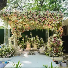 A mandap overflowing with a fantasy of flowers. For us, decor is poetry. We weave your story into every petal and leaf, creating a sacred space that is as beautiful and unique as your love.