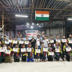 Celebrating our students' progress is a big part of our culture. Here, our young warriors proudly display their grading certificates after a successful evaluation, marking another step forward in their martial arts journey.