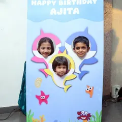 Creating fun photo opportunities is a key part of my themed parties. This custom Baby Shark photo booth cutout lets kids become part of the underwater world.