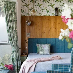 A bedroom should be a personal retreat. In our Valley of Dreams project, we used warm timber, a custom-upholstered bed, and lush foliage prints to create a cozy, cabin-like atmosphere that feels both grounded and dreamlike, blurring the line between the indoors and the Himalayan landscape outside.