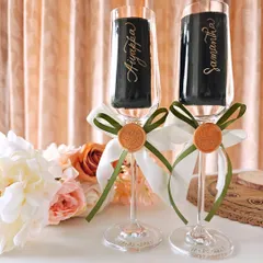 A toast to love, personalized with elegance. These champagne flutes are carefully hand-engraved with the couple's names and wedding date, creating a perfect keepsake for anniversaries and special celebrations.