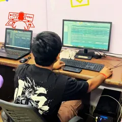 Students collaborate on a project, working together at a production workstation. Our courses foster a community of learners who can share ideas and grow their skills together.