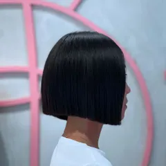 A sharp, blunt bob is all about precision. For this look, I used my clippers to create an impeccably clean line, resulting in a timeless and powerful style. This haircut is perfect for anyone wanting a chic and low maintenance look that still makes a statement.