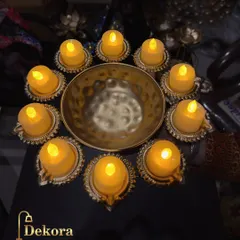 For a safe and long-lasting festive glow, this brass urli comes with a set of battery-operated LED diyas. It provides the traditional look of diyas without the flame, perfect for homes with children or for extended use.