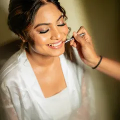 A behind-the-scenes moment with this beautiful bride from Dubai. I'm applying a soft lipstick to complete her elegant and timeless Catholic bridal makeup.